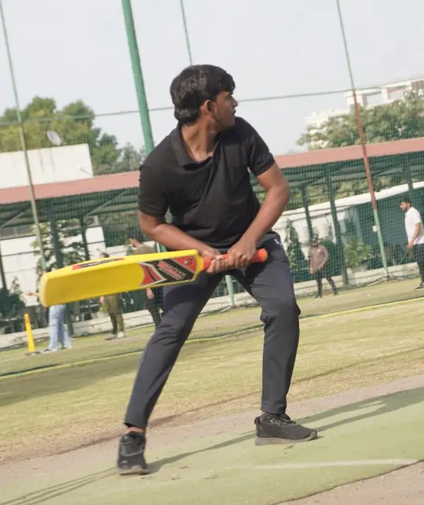 Right-handed batsman hitting a boundary