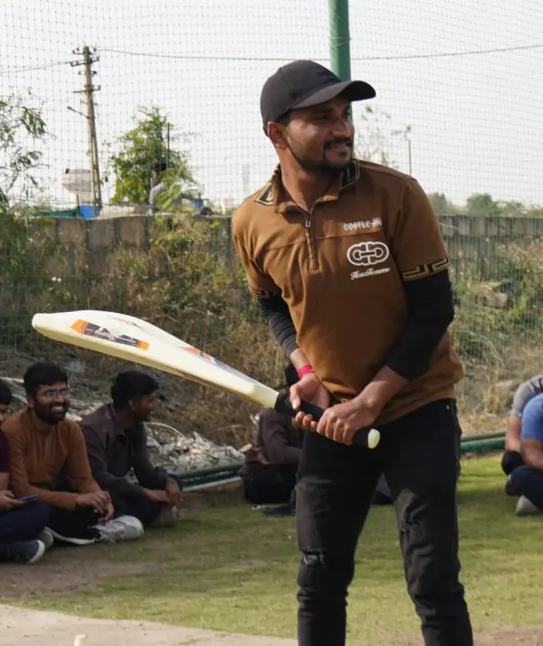 Player striking the ball through mid-wicket
