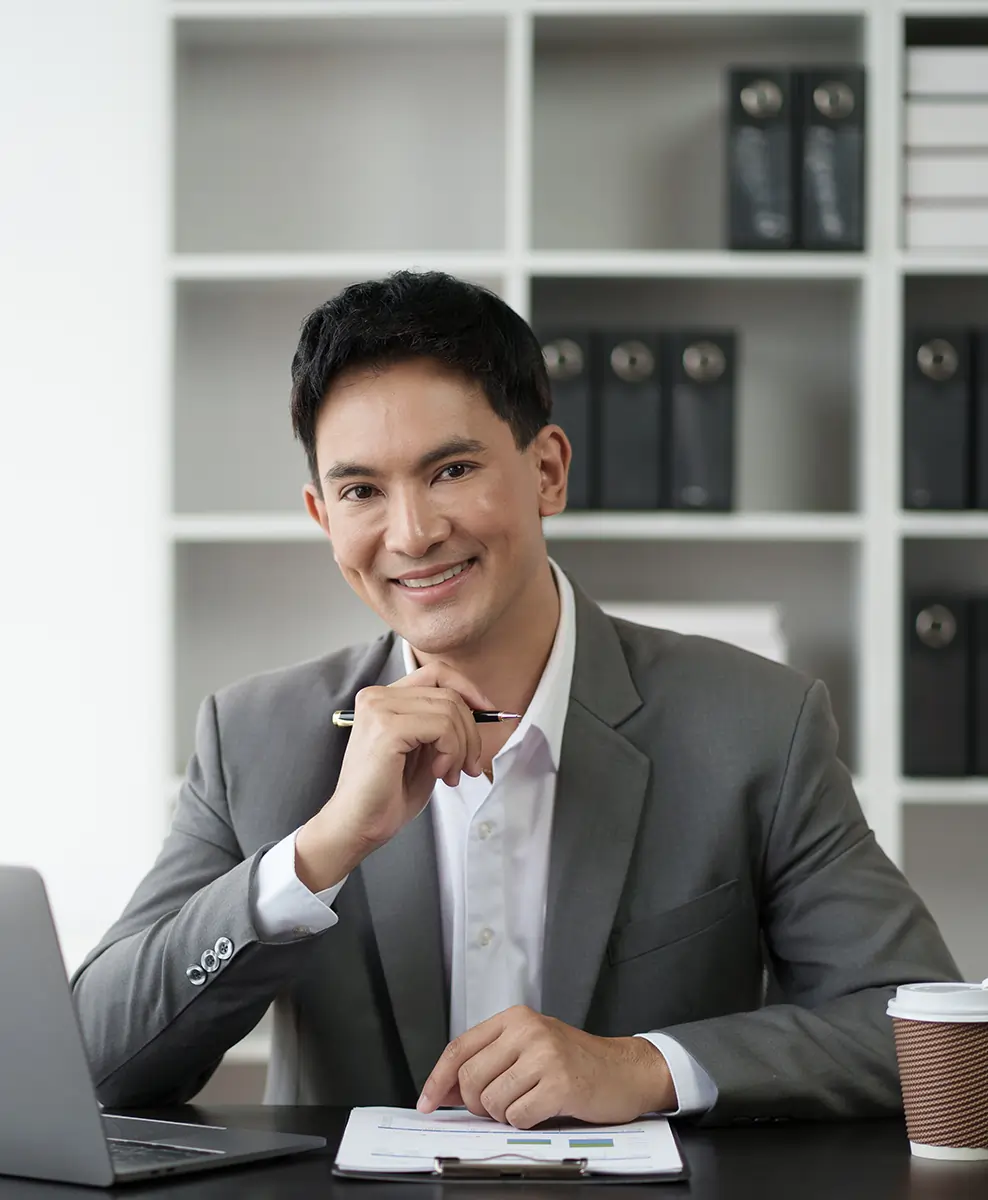 Business professional using laptop in office, sharing customer feedback on Odoo ERP system.