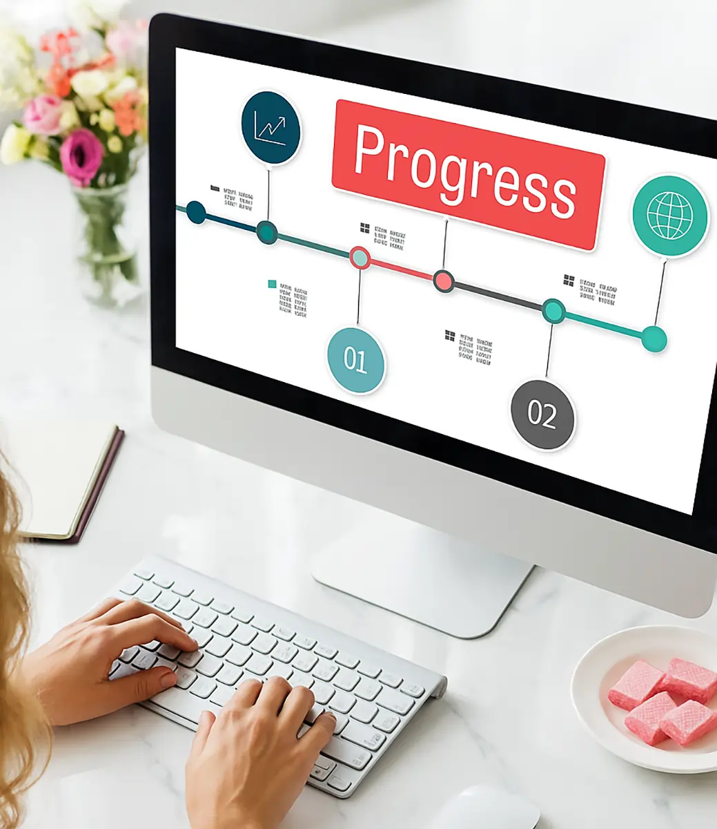 Businesswoman viewing Odoo ERP implementation process on desktop working at marble desk