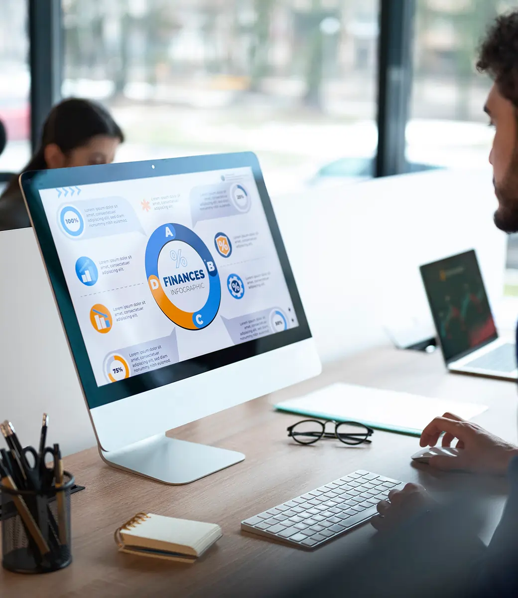 Professionals in an office analyzing financial graphs and data together, representing business planning and Odoo ERP analytics.