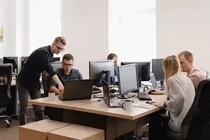 Group of young business people working in the Information Technology office managing projects under project management system