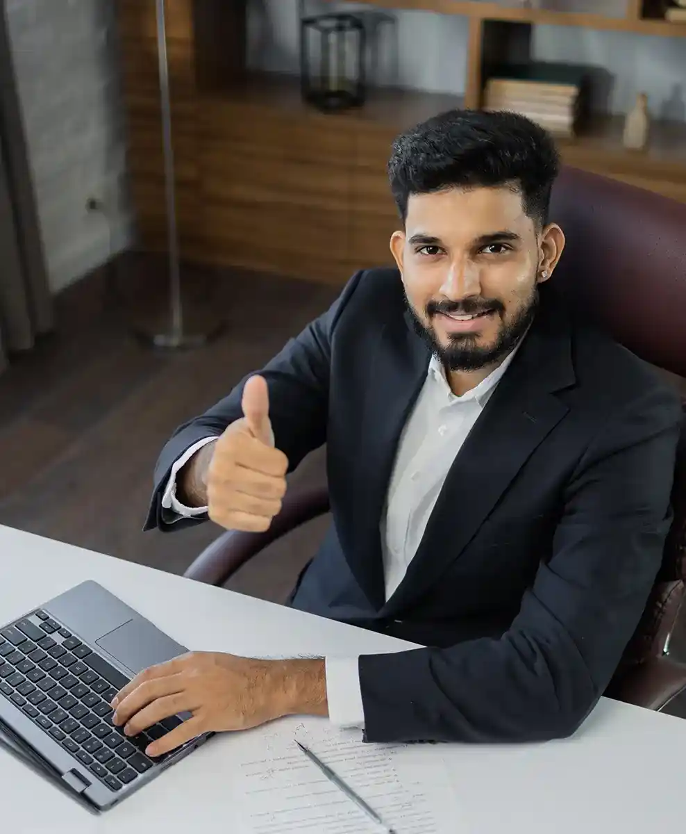 Business professional analyzing data on a laptop representing positive customer feedback and satisfaction with Softhealer’s Odoo solutions.