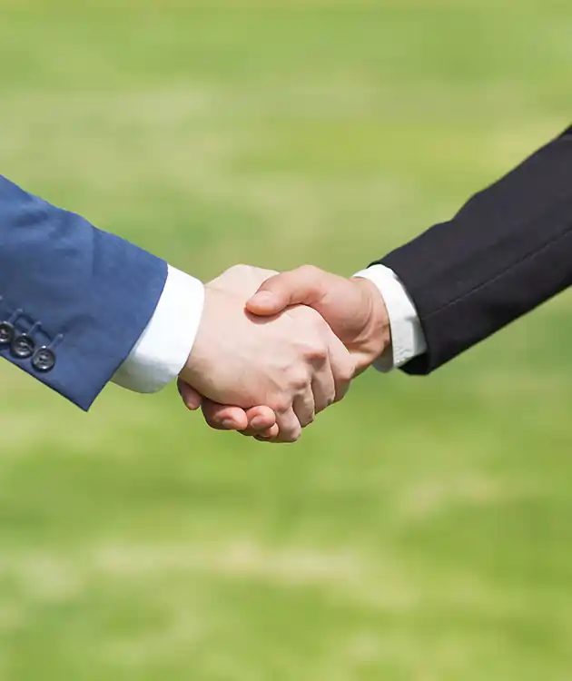 Business partners shaking hands, symbolizing Odoo ERP partnership and successful collaboration