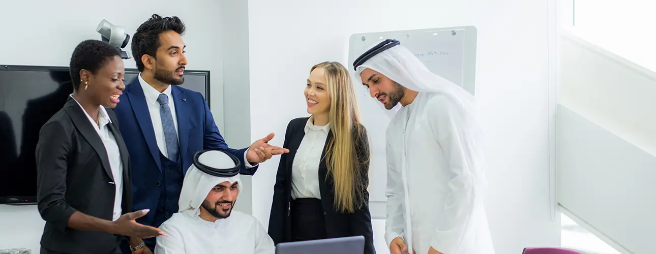 Business professionals in a meeting discussing ERP solutions at Softhealer Technologies.